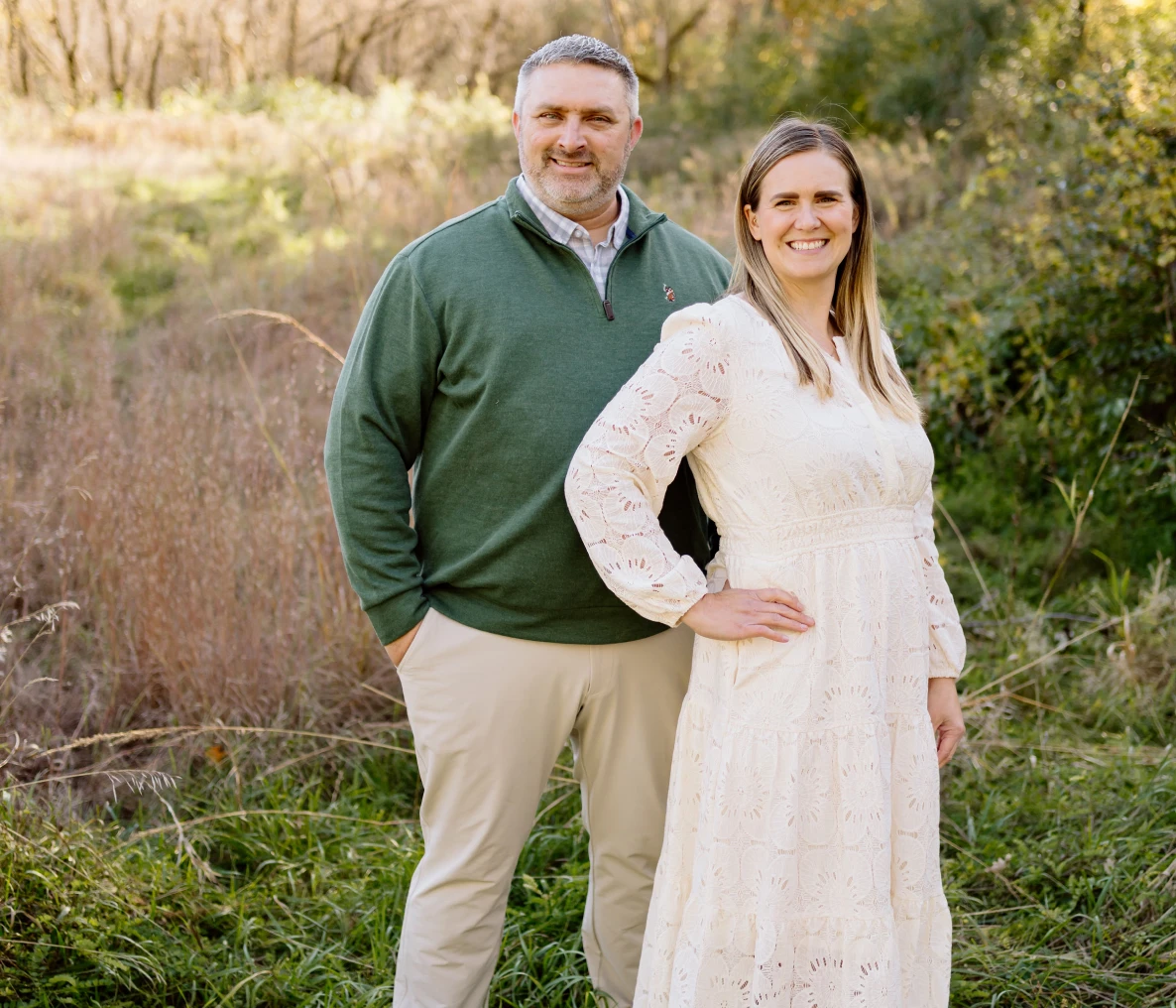 Pair standing in nature setting